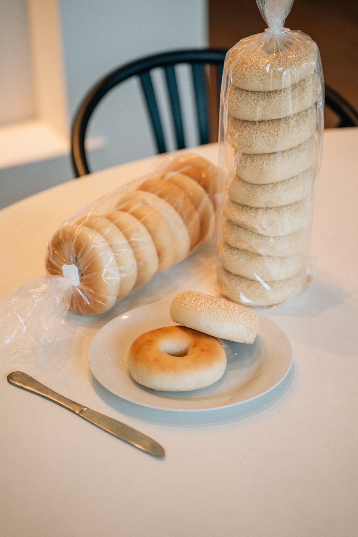 Goodness Gracious bagel packs and a plated bagel on the counter at Parnell