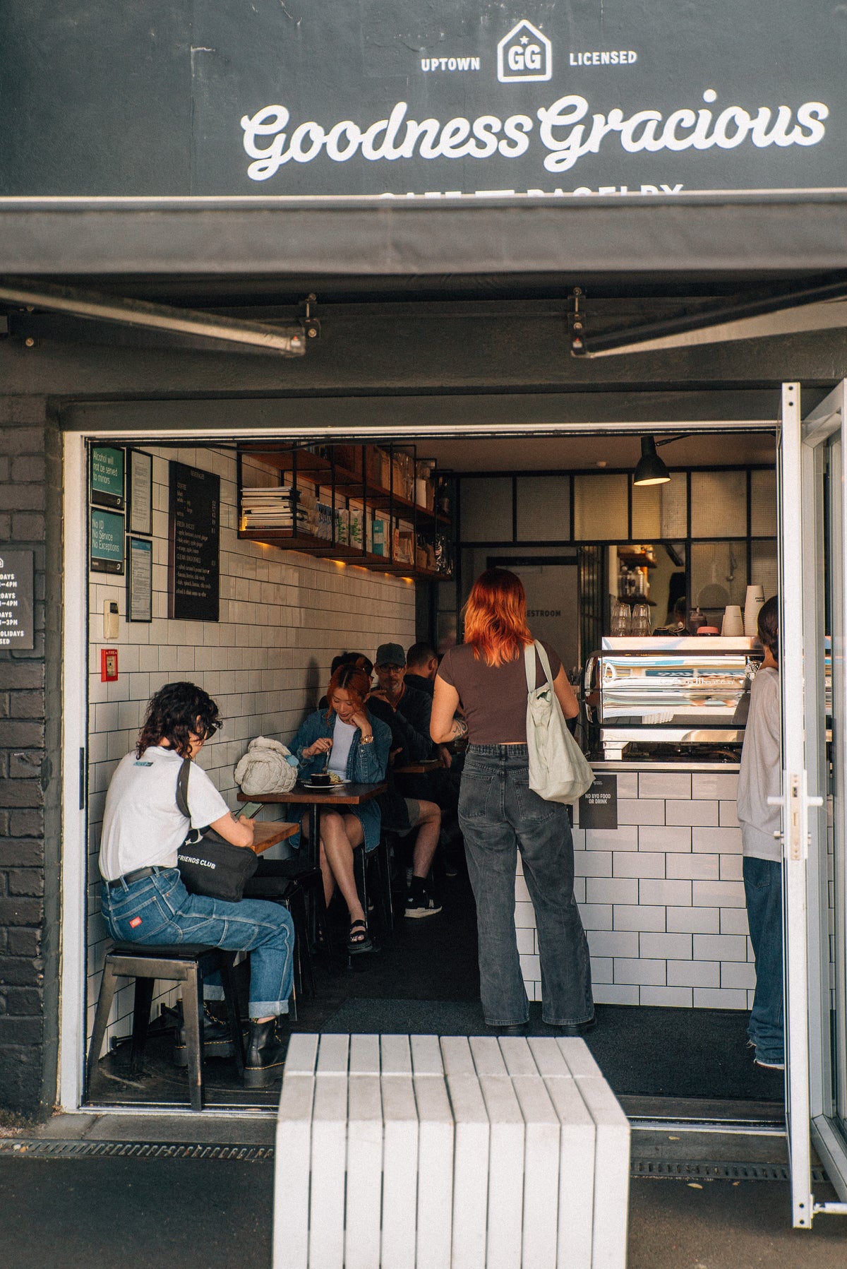 Customers inside Goodness Gracious Eden Terrace, seen through the open front doors